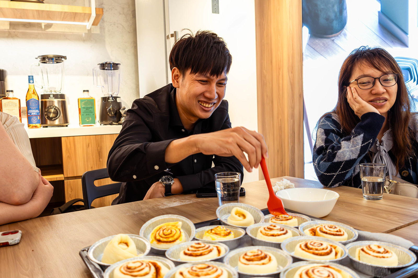 Piping cinnamon buns at the baking workshop
